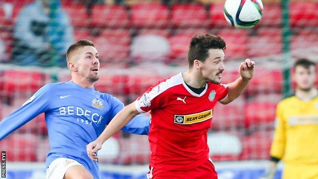 Glenavon's Daniel Kearns puts pressure on Tomas Cosgrove at Solitude