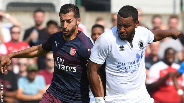 Henrikh Mkhitaryan of Arsenal competes for the ball with Morgan Ferrier of Boreham Wood