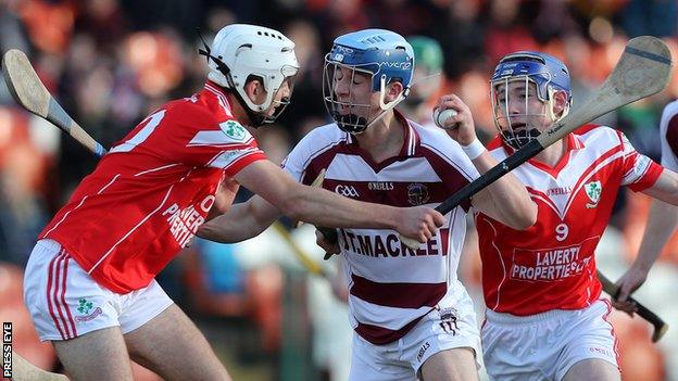 Slaughtneil's Shane McGuigan attempts to get past Loughgiel's Maol Connolly