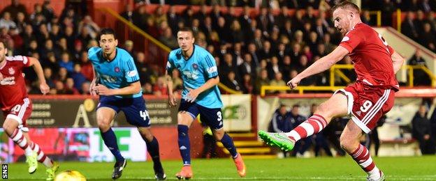 Adam Rooney scores Aberdeen's opener from the penalty spot