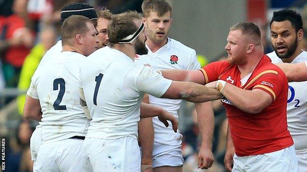 England's Joe Marler (1) is confronted by Samson Lee