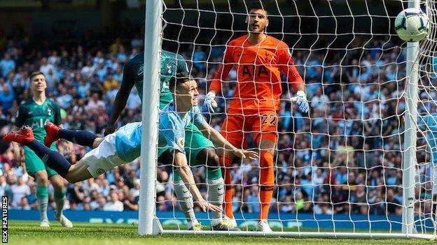 Phil Foden scores for Manchester City against Tottenham Hotspur in a Premier League game