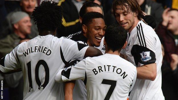 Jonathan de Guzman (centre) celebrates a goal with Wilfried Bony, Leon Britton and Michu