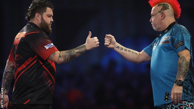 Peter Wright battled back to beat Michael Smith, left, in a thrilling final