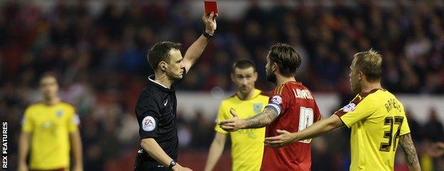 Henri Lansbury is sent off after his clash with Ben Mee