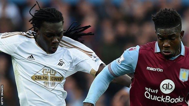 Bafetimbi Gomis (left) with Micah Richards