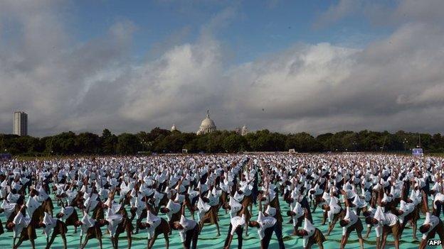 Members of the National Cadet Corps (NCC) take part in a mass yoga session in Kolkata