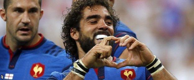 Yoann Huget celebrates his try for France