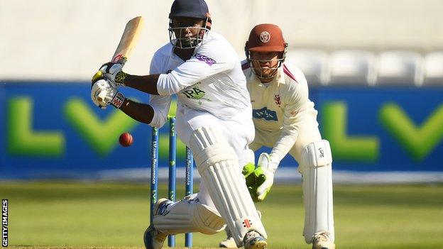 Hampshire all-rounder Keith Barker plays a reverse sweep against Somerset