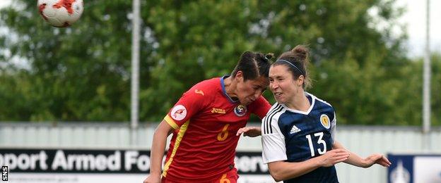 Jane Ross (right) heads Scotland's second goal against Romania