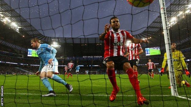 Man City's Kevin de Bruyne (left) starts to celebrate after his fourth goal of the season