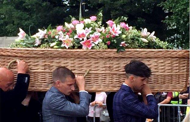 Sue Davey's coffin being carried