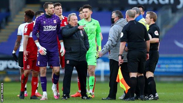 Neil Warnock angrily confronts referee Gavin Ward at Swansea