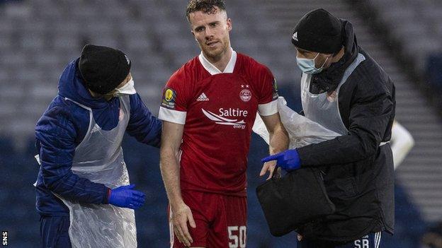 Marley Watkins went off injured in the closing stages of Aberdeen's cup defeat to Celtic