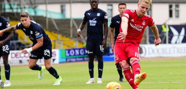 Gary Mackay-Steven scores his penalty