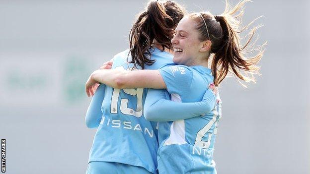 Keira Walsh celebrates with Caroline Weir