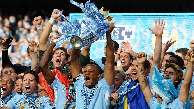 Vincent Kompany lifting the Premier League trophy in 2012