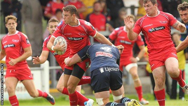 Scarlets fly-half Steven Shingler takes on the Bedford defence in Llandovery