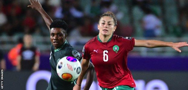 Nigeria forward Gift Monday in action against Morocco midfielder Elodie Nakkach