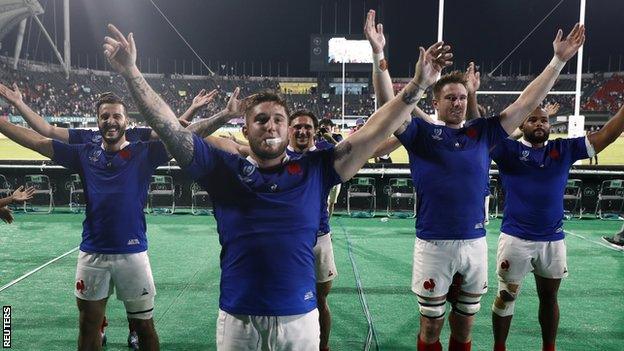 France celebrate with fans at the final whistle