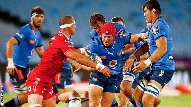 Scarlets' Aaron Shingler tackles Bulls' Johan Grobbelaar