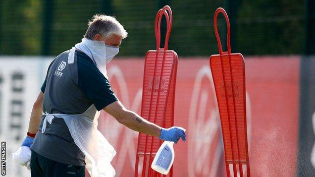 Southampton kit man Mark Forbes cleaned down training equipment during the session