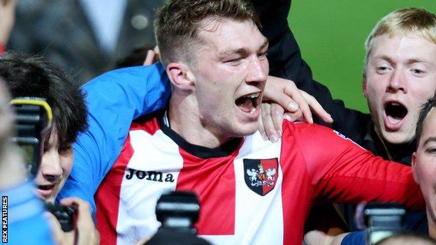 Jack Stacey celebrates Exeter's play-off semi-final victory against Carlisle