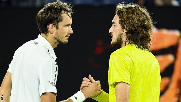 Daniil Medvedev and Stefanos Tsitsipas shake hands at the net