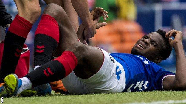 Lassana Coulibaly lies in pain after suffering a late injury against St Mirren