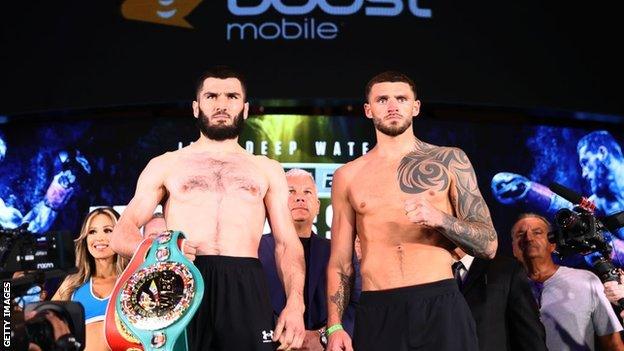 Artur Beterbiev and Joe Smith face off at a weigh in