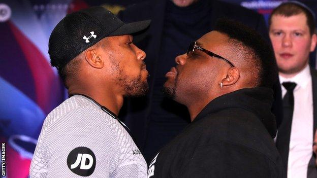 Anthony Joshua and Jarrell Miller square up at a news conference