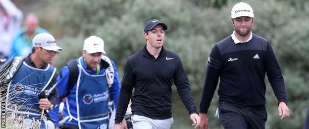 Rory McIlroy and Jon Rahm chat during Thursday's round at Portstewart