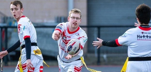 Josh Taylor throwing a pass in a game for St Helens' learning disability rugby league side