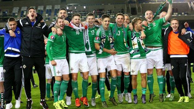 Northern Ireland players take the acclaim of their supporters after beating Greece 3-1 at Windsor Park