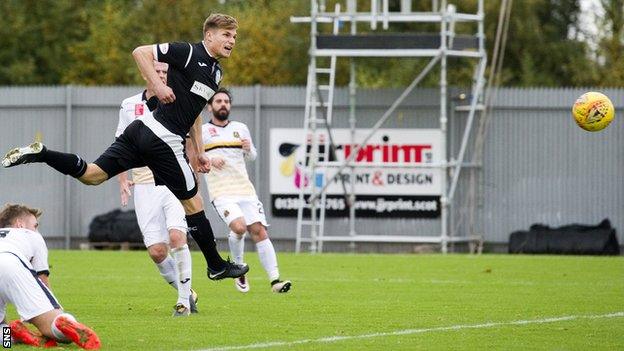 Gavin Reilly heads in the opening goal for St Mirren