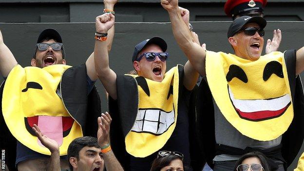 Some fans supporting James Ward dressed as emoticons for his match against Novak Djokovic