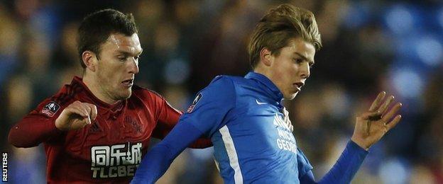 Peterborough midfielder Martin Samuelsen (right) and West Brom's Craig Gardner