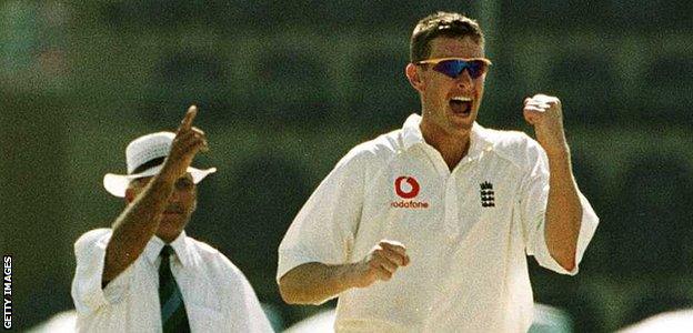 England's Ashley Giles celebrates taking a wicket