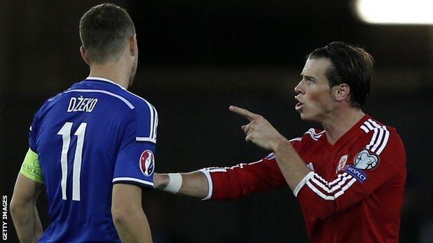 Edin Dzeko (left) with Gareth Bale during Bosnia's 0-0 draw with Wales in October 2013