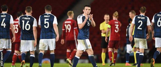 John McGinn applauds the Hampden crowd