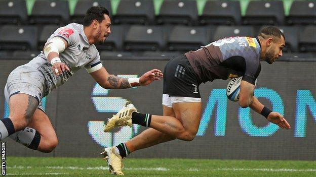 Harlequins centre Joe Marchant (right) scores a try against Sale Sharks