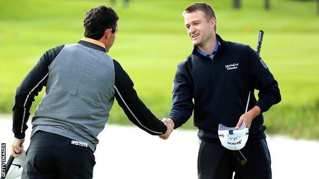 Russell Knox (right) shakes hands with Rory McIlroy after their final round at the Irish Open