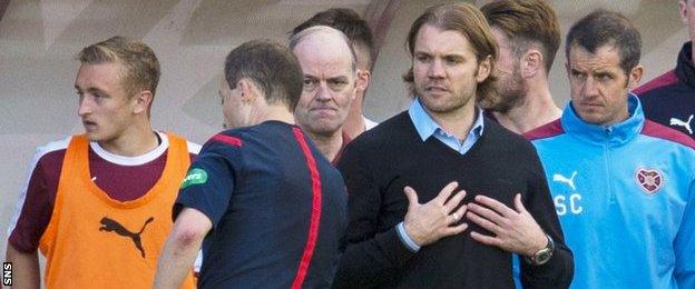 Hearts manager Robbie Neilson (centre right)