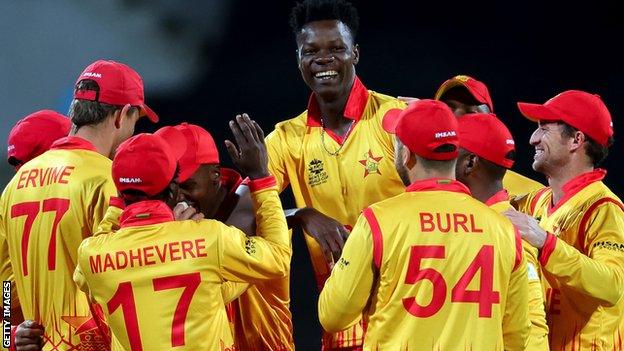 Blessing Muzarabani (centre) celebrates a wicket for Zimbabwe