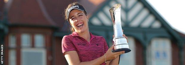 Georgia Hall of England poses for a photo with her trophy after winning the tournament during day four of Ricoh Women's British Open at Royal Lytham & St. Annes on August 5, 2018 in Lytham St Annes, England.