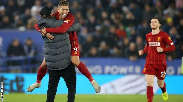 Jurgen Klopp celebrating with Roberto Firmino