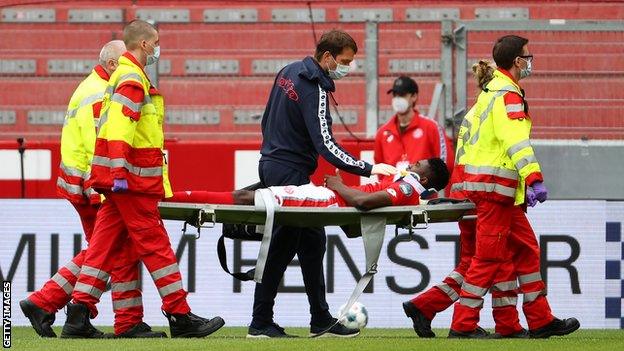 Nigeria's Taiwo Awoniyi being stretchered off with a head injury