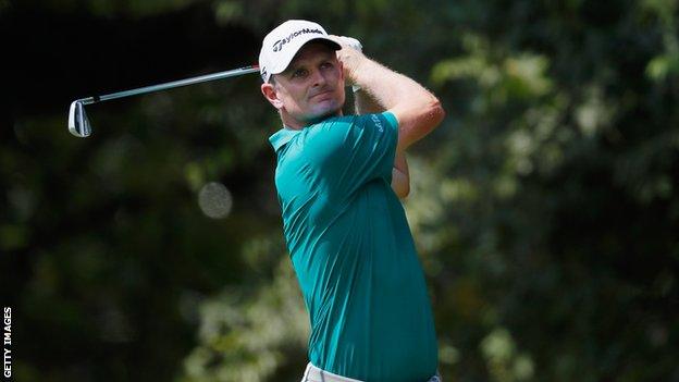 Justin Rose hits a shot