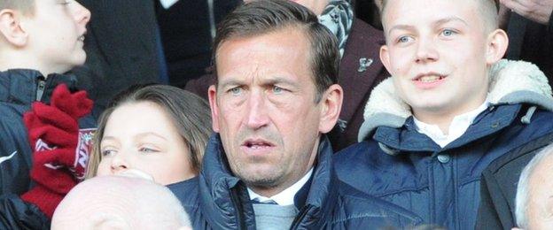 New Northampton boss Justin Edinburgh was in the stand as he watched the Cobblers for the first time since Friday's appointment