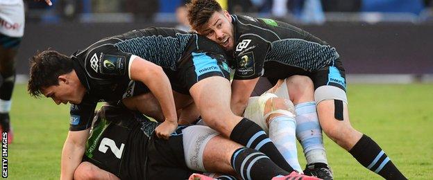 Glasgow scrum-half Ali Price prepares to fire out a pass against racing 92